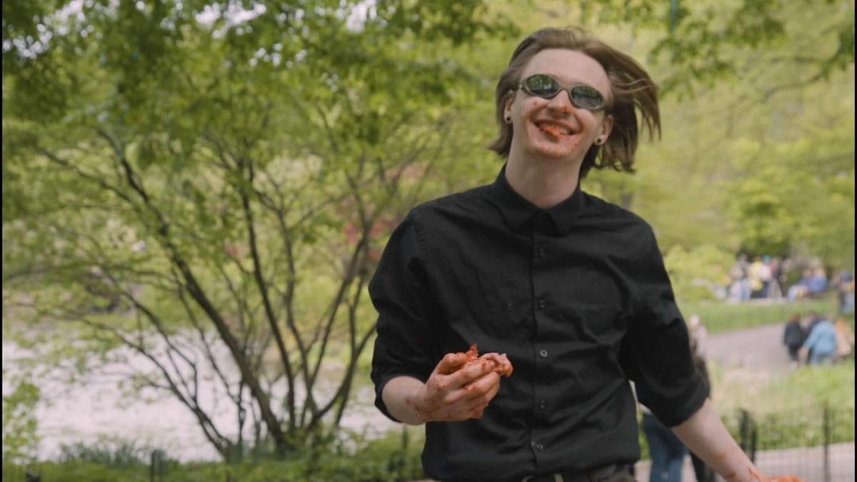 Bomby skips down the Central Park path with his lunch